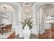 Elegant foyer with hardwood floors, arched doorways, and a decorative table centerpiece at 8301 Caesars Head Dr, Waxhaw, NC 28173