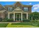 Brick home featuring a welcoming front porch and manicured landscaping at 8301 Caesars Head Dr, Waxhaw, NC 28173