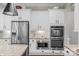 This gourmet kitchen boasts stainless steel appliances and double ovens, perfect for entertaining at 8301 Caesars Head Dr, Waxhaw, NC 28173