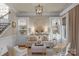 Inviting living room with custom built-ins, neutral tones and recessed lighting at 8301 Caesars Head Dr, Waxhaw, NC 28173