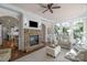 This living room is bright with a fireplace and lots of natural light at 8301 Caesars Head Dr, Waxhaw, NC 28173