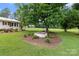 Expansive backyard featuring lush greenery, mature trees, and a well-maintained lawn at 9135 Stokes Ferry Rd, Salisbury, NC 28146
