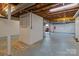 Spacious unfinished basement with white-painted brick walls, offering potential for a recreation room or storage at 9135 Stokes Ferry Rd, Salisbury, NC 28146