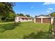 Charming home exterior with a well-maintained lawn and a detached two-car garage at 9135 Stokes Ferry Rd, Salisbury, NC 28146