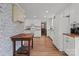 Spacious kitchen featuring white cabinetry, hardwood floors, and stainless appliances at 9135 Stokes Ferry Rd, Salisbury, NC 28146