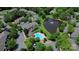 Scenic aerial view of the community pool, pond, and surrounding lush green landscaping at 9216 Four Mile Creek Rd, Charlotte, NC 28277