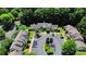 Community aerial view featuring multiple townhome buildings, parking lots, and green spaces at 9216 Four Mile Creek Rd, Charlotte, NC 28277