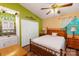 Serene bedroom featuring wood flooring, double closets, and a well-lit vanity area at 9216 Four Mile Creek Rd, Charlotte, NC 28277