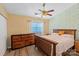 Comfortable bedroom featuring a ceiling fan, a dresser, and a window for natural light at 9216 Four Mile Creek Rd, Charlotte, NC 28277