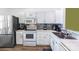 Bright kitchen with white cabinets, stainless steel appliances, and modern backsplash at 9216 Four Mile Creek Rd, Charlotte, NC 28277