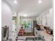 Well-lit kitchen featuring modern appliances, white cabinetry, and a view to the outside at 9216 Four Mile Creek Rd, Charlotte, NC 28277