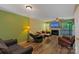 Cozy living room with hardwood floors, fireplace, and comfortable seating at 9216 Four Mile Creek Rd, Charlotte, NC 28277