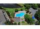 Overhead shot of a bright blue community pool with surrounding lounge chairs and greenery at 9216 Four Mile Creek Rd, Charlotte, NC 28277