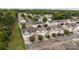 Aerial view showcases an expansive community with well-manicured lawns and tree-lined streets at 10207 Garmoyle St, Charlotte, NC 28277