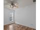 Empty bedroom showcasing wood-look floors and a ceiling fan at 10207 Garmoyle St, Charlotte, NC 28277