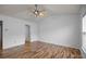 Bedroom with ceiling fan, wood-look floors, and attached bathroom at 10207 Garmoyle St, Charlotte, NC 28277
