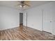Bedroom with two closets, a ceiling fan, and wood-look flooring at 10207 Garmoyle St, Charlotte, NC 28277
