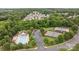 Aerial view of the community pool and tennis courts surrounded by lush green landscaping and trees at 10207 Garmoyle St, Charlotte, NC 28277