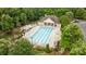 Beautiful community pool with ample seating and a pergola with landscaped grounds at 10207 Garmoyle St, Charlotte, NC 28277