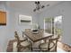 Dining room featuring modern chandelier and sliding glass doors for natural light at 10207 Garmoyle St, Charlotte, NC 28277