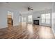 Spacious living room with hardwood floors, fireplace, and ample natural light at 10207 Garmoyle St, Charlotte, NC 28277