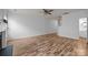 Open-concept living area with hardwood floors, fireplace and an airy feel at 10207 Garmoyle St, Charlotte, NC 28277