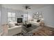 Virtually staged living room featuring a fireplace, stylish decor, and comfortable seating at 10207 Garmoyle St, Charlotte, NC 28277