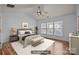 Virtually staged main bedroom with a large bed, bench, nightstands, and plenty of sunlight at 10207 Garmoyle St, Charlotte, NC 28277