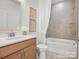 Cozy bathroom with wooden cabinets, a modern sink, and a tiled shower-tub combo at 1022 Paddlers Way # 136, Belmont, NC 28012