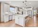 Modern kitchen with white cabinets, stainless steel appliances, and a large center island with seating at 1022 Paddlers Way # 136, Belmont, NC 28012