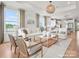 Open concept living room with large windows and hardwood floors at 1022 Paddlers Way # 136, Belmont, NC 28012