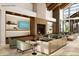 Beautifully decorated lobby with seating, fireplace, and expansive windows overlooking the green space at 1022 Paddlers Way # 136, Belmont, NC 28012