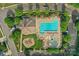 Overhead shot of community pool and play area with picnic pavilion, green lawns and trees at 10405 Scotland Ave, Indian Land, SC 29707