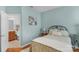 Bright, open bedroom next to bathroom with comfortable bed and natural lighting at 10405 Scotland Ave, Indian Land, SC 29707