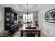 Elegant dining room with a large wooden table, decorative hutch, and sophisticated lighting at 10405 Scotland Ave, Indian Land, SC 29707