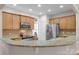 Open kitchen design with granite countertop bar, stainless steel appliances, and wood cabinets at 10405 Scotland Ave, Indian Land, SC 29707