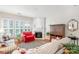 Bright living room boasts hardwood floors, a decorative fireplace, and natural light from large windows at 10405 Scotland Ave, Indian Land, SC 29707