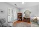 Cozy living room with natural light, plantation shutters, and comfortable seating area at 10405 Scotland Ave, Indian Land, SC 29707