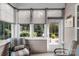 Cozy sunroom featuring multiple windows and a door to the outside, perfect for relaxation and enjoying the outdoors at 10405 Scotland Ave, Indian Land, SC 29707