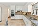 Bright kitchen with tile backsplash, stainless steel appliances, and granite countertops at 1049 Regency Dr, Charlotte, NC 28211
