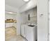 Efficient laundry area featuring cabinetry for storage, plus washer and dryer at 1049 Regency Dr, Charlotte, NC 28211