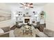Warm living room with a decorative fireplace, hardwood floors, and recessed lighting at 1049 Regency Dr, Charlotte, NC 28211