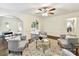 Spacious living room with hardwood floors, arched doorways, and neutral decor at 1049 Regency Dr, Charlotte, NC 28211