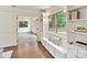 Bright sunroom features built-in benches and shelving, and lots of natural light at 1049 Regency Dr, Charlotte, NC 28211