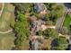 Aerial view showcasing an estate home surrounded by mature trees, lawns and manicured landscaping at 10508 Old Wayside Rd, Charlotte, NC 28277