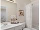 Well-lit bathroom with a white vanity, mirror, and a shower-tub combo, providing a practical and clean space at 10508 Old Wayside Rd, Charlotte, NC 28277