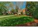 Traditional brick home with a well-maintained lawn and tidy landscaping at 10508 Old Wayside Rd, Charlotte, NC 28277