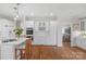 Well-appointed kitchen featuring custom cabinetry, dual ovens, and a wine rack at 10508 Old Wayside Rd, Charlotte, NC 28277