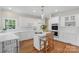 Modern kitchen with white cabinetry, stainless steel appliances, and breakfast bar at 10508 Old Wayside Rd, Charlotte, NC 28277