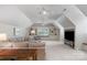 Bright living room boasts built-in shelves, neutral decor, and ample natural light at 10508 Old Wayside Rd, Charlotte, NC 28277